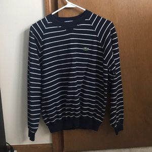 Blue and white striped pull over Lacoste shirt